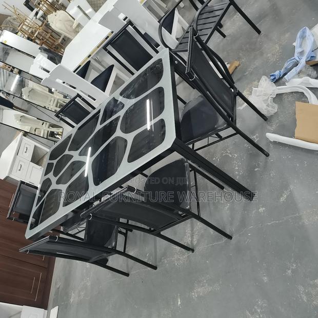 Modern Metal and Glass Dining Table Set With Six Black Chairs photo 2