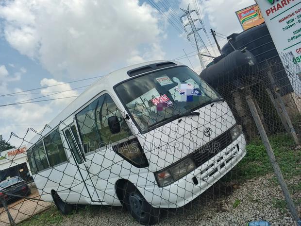 Toyota Coaster 2018 White photo 2