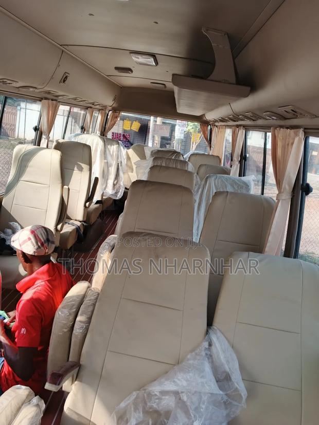 Toyota Coaster 2018 White photo 8
