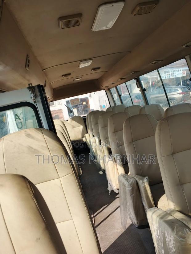Toyota Coaster 2018 White photo 5