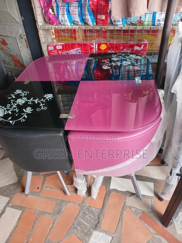 An Authentic Four Seater Glass Dining Set