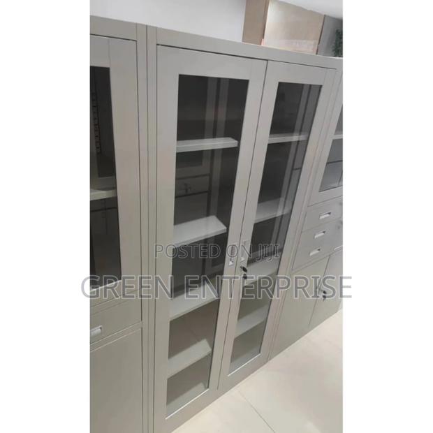 Modern Gray Metal Cabinet With Glass Doors and Drawers