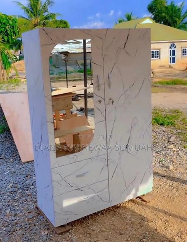 Two in One Wardrobe Which Has a Mirror in the Front ,With Two Drawers.