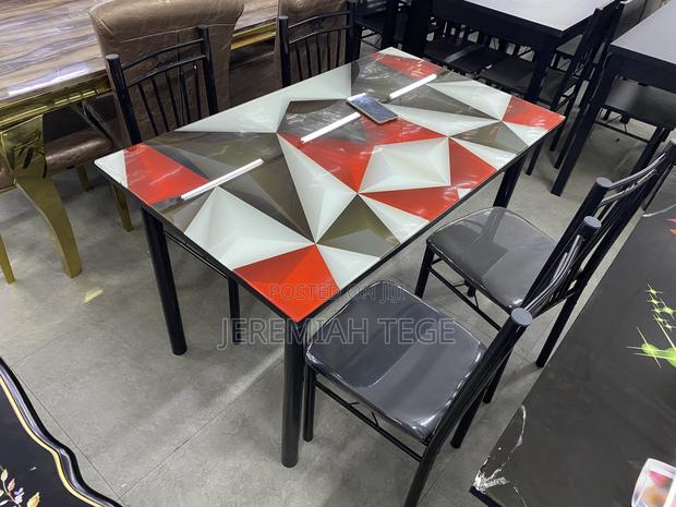 Modern Quality Dining Table Set With Glossy Glass Finishing photo 2