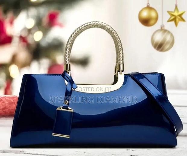 Elegant Structured Glossy Handbag With Metal Handle