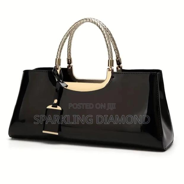 Elegant Structured Glossy Handbag With Metal Handle photo 2