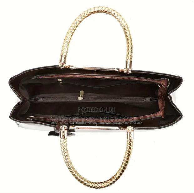 Elegant Structured Glossy Handbag With Metal Handle photo 3