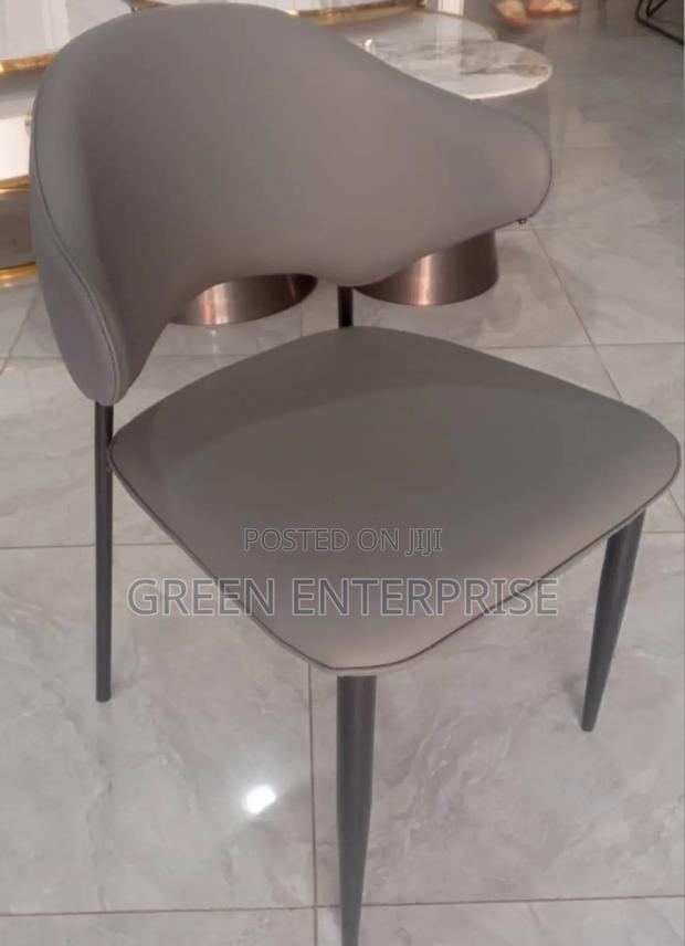 Stylish Armless Dining Chair With Unique Copper Accent