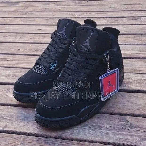 Air Jordan 4 Retro "Black Cat" Sneakers.