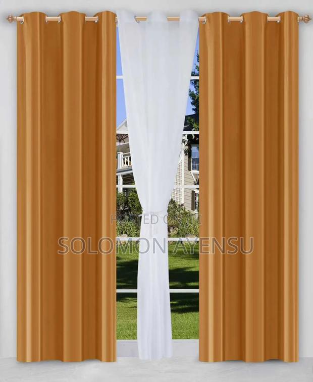 Gold/Amber Sunblock Curtains and White Voile Sheer Curtains.