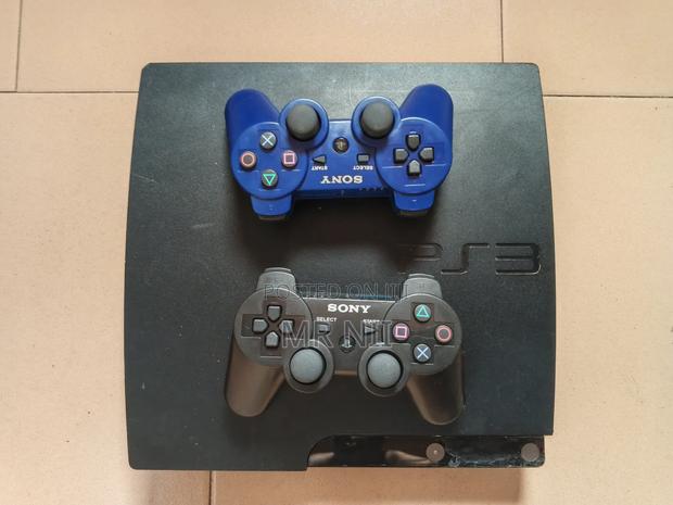 Ps3 Slim With 2 Controllers and 15 Games