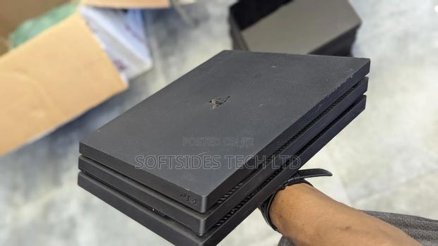 Clean Playstation 4 Pro Available With 17 Games And 2 Free Controllers photo 2