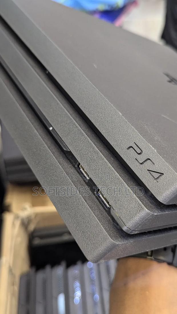 Clean Playstation 4 Pro Available With 17 Games And 2 Free Controllers photo 3